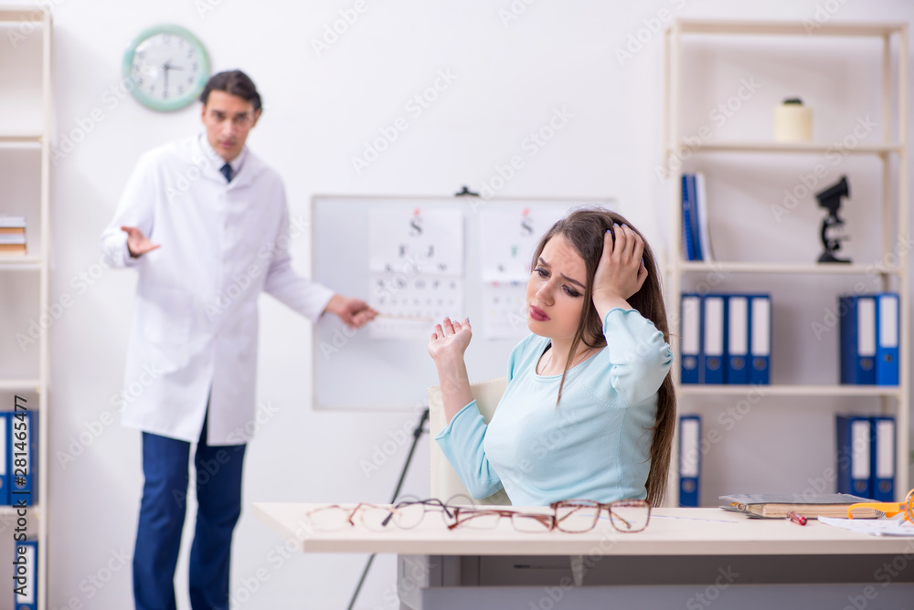 Young woman visiting male doctor oculist Young woman visiting male doctor oculist