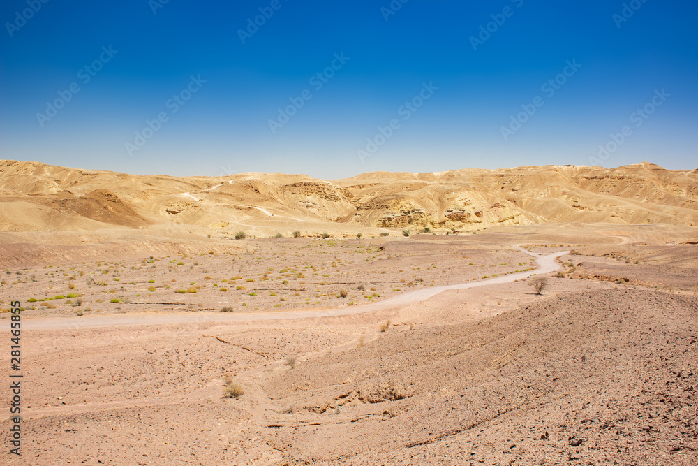 desert valley to horizon line with mountains background and ground trail scenery dry landscape photography 