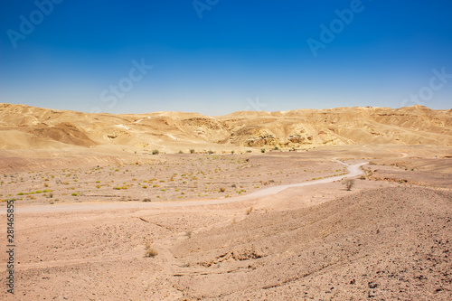 desert valley to horizon line with mountains background and ground trail scenery dry landscape photography 