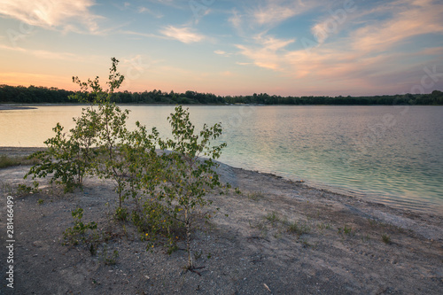 Azure lake called Osadnik Gajowka near Psary village, Poland photo