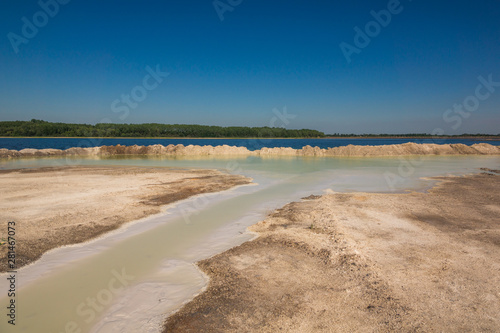 Azure lake called Osadnik Gajowka near Psary village, Poland