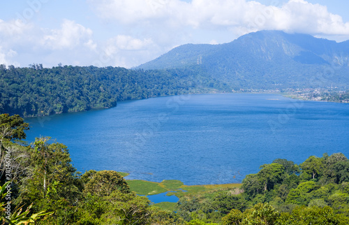 Fototapeta Naklejka Na Ścianę i Meble -  View of lake Buyan (Danau Buyan) from the top. Landscape with lake and mountain views. Bedugul, Buleleng, Bali, Indonesia.