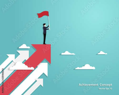 Businessman holding flag standing on red arrow