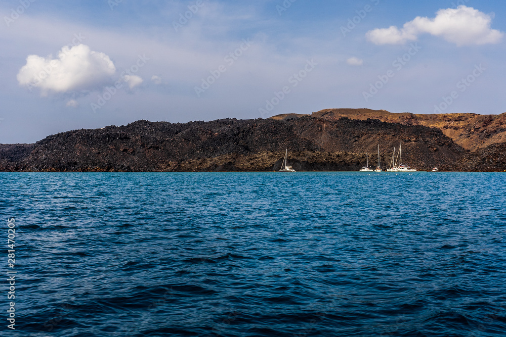 Yachts near the Santorini Volcano Yachts near the Santorini Volcano
