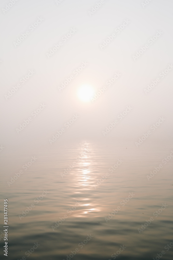 Sunrise over Casco Bay fog