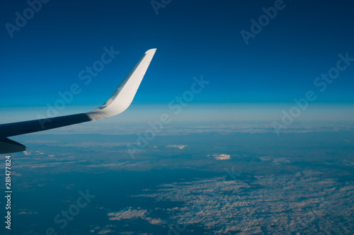 Aerial view from plane on blue sky