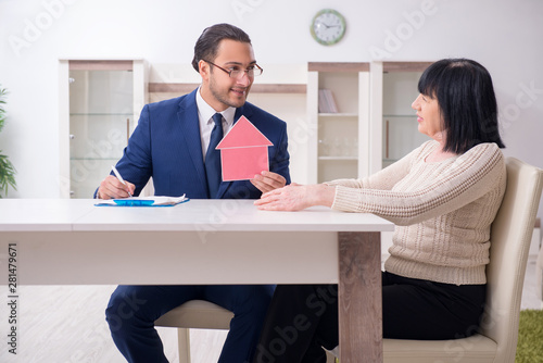 Male real estate agent and female client in the apartment