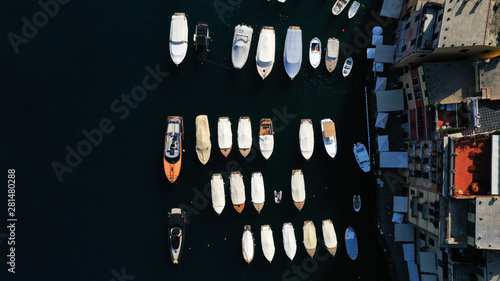 Aerial view of boats in dark blue sea and houses. Portofino Bay, Italy. © dimabucci