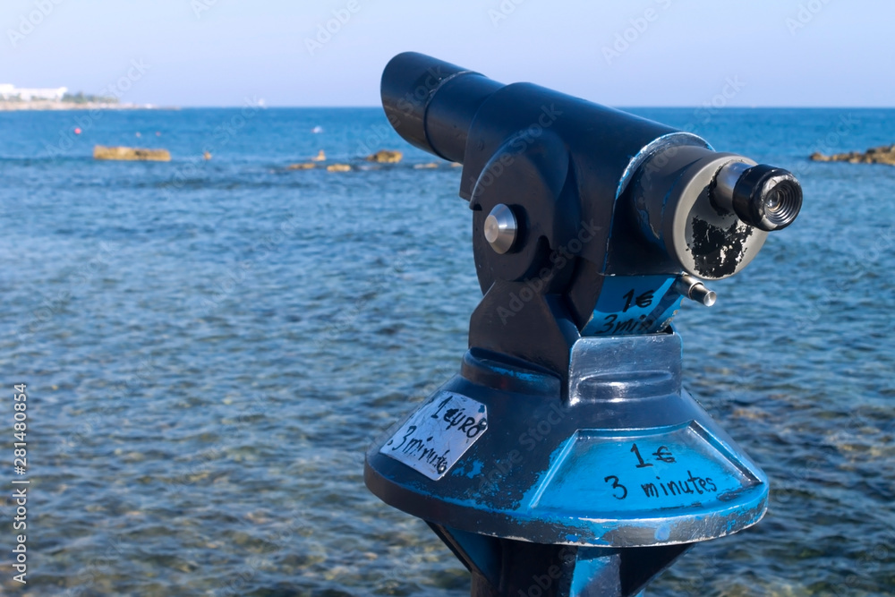 Pay per view telescope in front of the sea