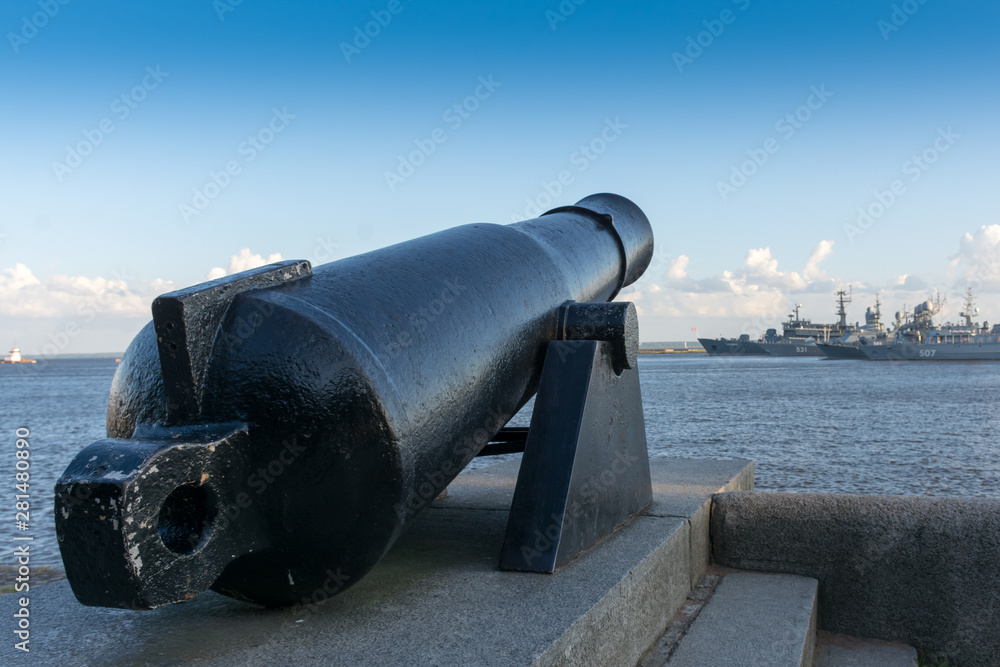 Ancient cannon on the sea promenade in Kronstadt