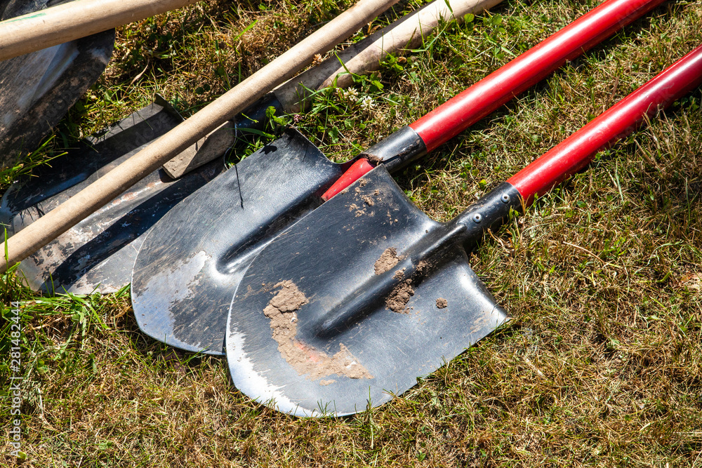 Digging shovels. Garden tools. The gardener left a spade on the street. Works on the land.