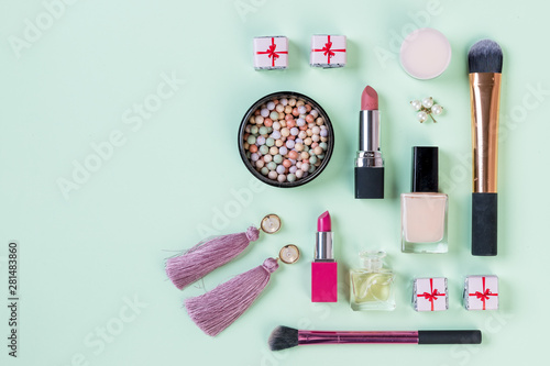 Flat lay composition with makeup products on light green background.set of professional decorative cosmetics, makeup tools and accessory. beauty, fashion and shopping concept.Beauty flat lay