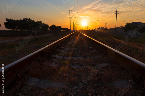 Reflection of the sun on the rails at sunset
