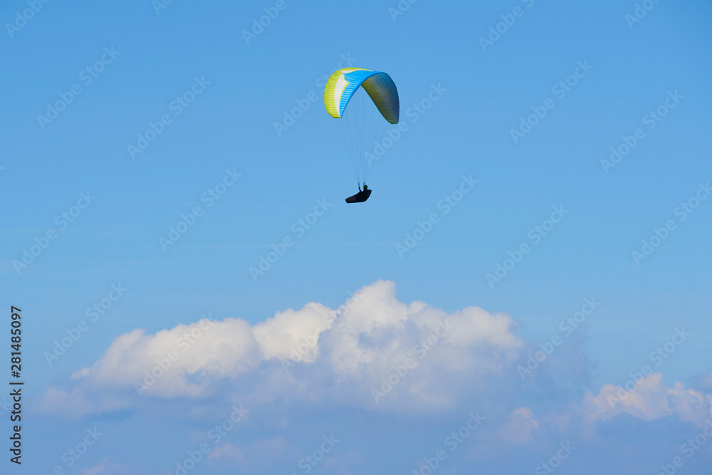 Paraglider flying over the Garda Lake (Lago di Garda or Lago Benaco), Panorama of the gorgeous Garda lake surrounded by mountains. Paragliding is very popular sport in Monte Baldo. Malcesine, Italy Paraglider flying over the Garda Lake (Lago di Garda or Lago Benaco), Panorama of the gorgeous Garda lake surrounded by mountains. Paragliding is very popular sport in Monte Baldo. Malcesine, Italy