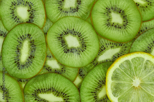 One lemon slice on kiwi background  top view  flat lay. Not like others concept.