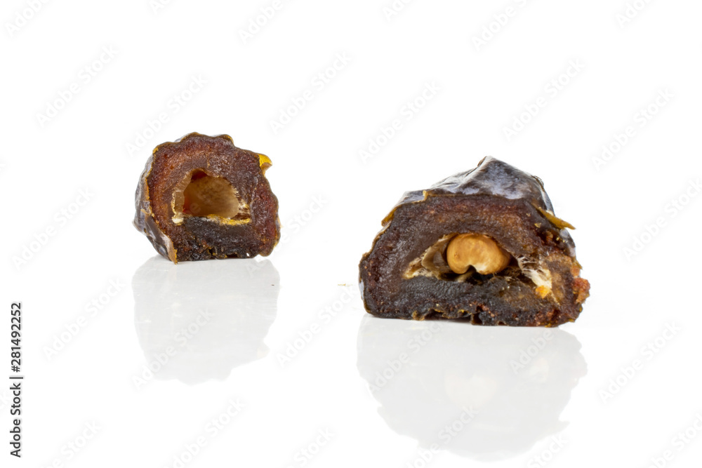 Group of two halves of dried brown date medjool isolated on white background Group of two halves of dried brown date medjool isolated on white background