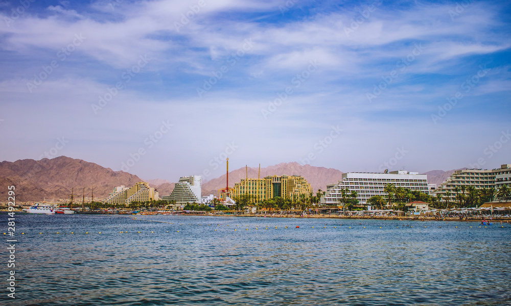 summer vacation destination photography of the most south Israeli city Eilat with hotel apartment buildings along Red sea beach with port scenic landscape place 