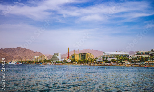 summer vacation destination photography of the most south Israeli city Eilat with hotel apartment buildings along Red sea beach with port scenic landscape place  © Артём Князь