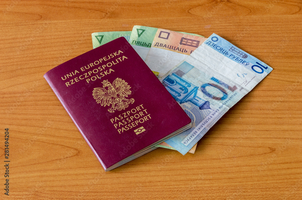 Fototapeta premium Polish biometric passport and Belarusian Currency.