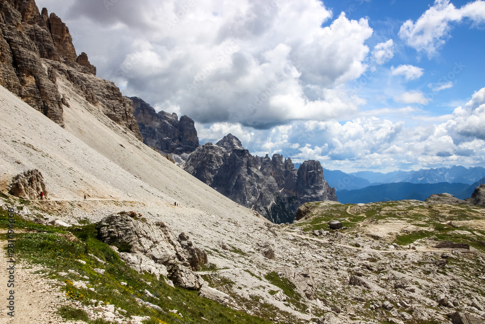 clouds over mountain trail in Dolomites