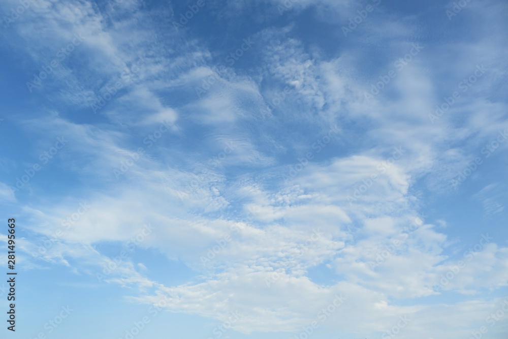 Beautiful blue sky with fluffy clouds, natural background