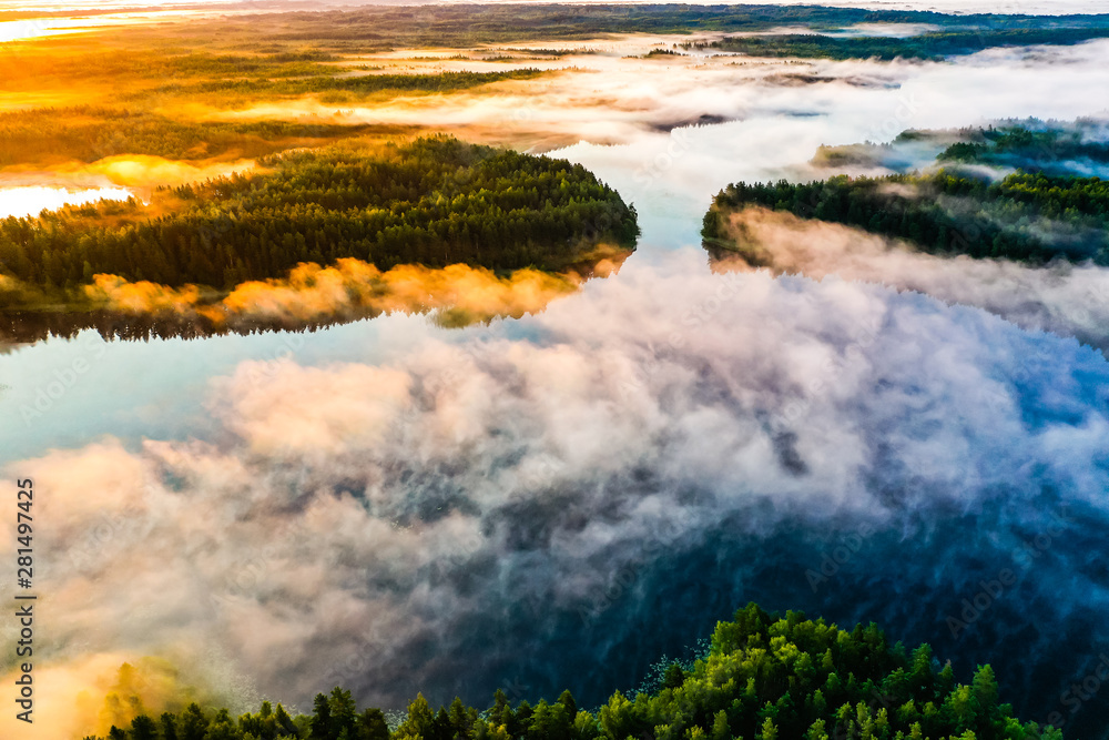 Beautiful lakes and green forest at bright sunrise. Morning in countryside concept. Aerial landscape