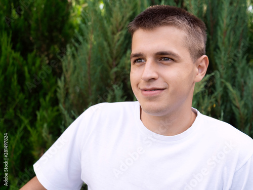 Teen boy posts in social networks on his smartphone. Portrait. Concept.
