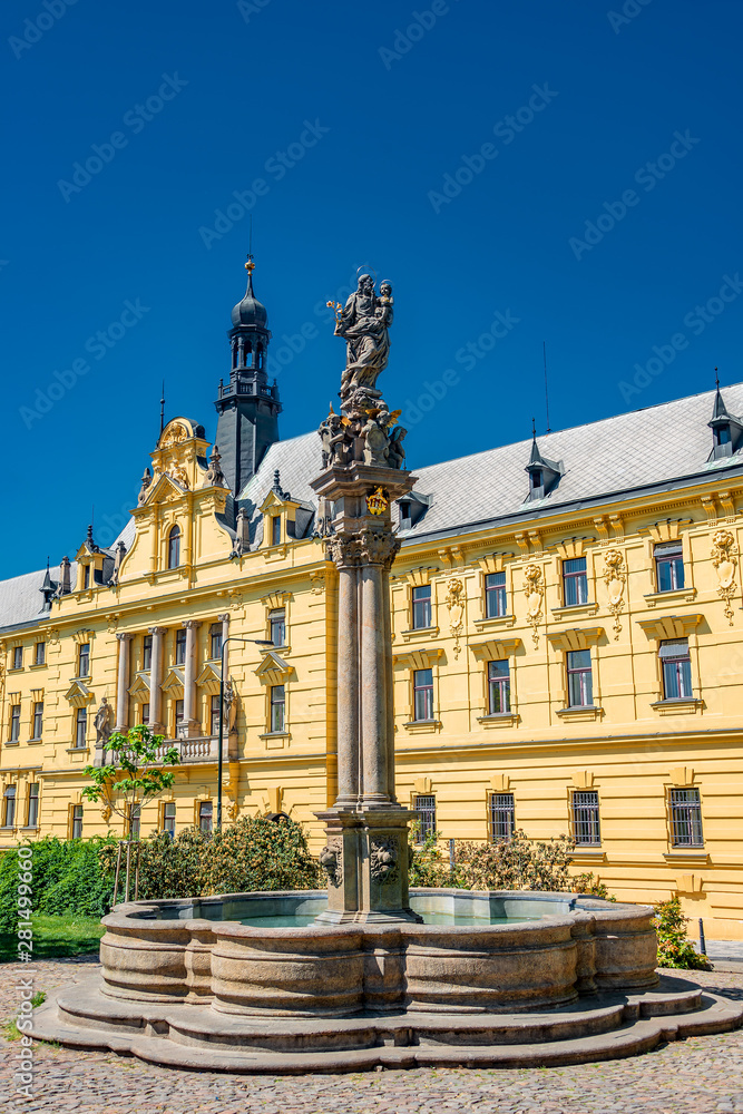 Statue of Saint Joseph with a child on top of the column of fountain at Charles Square, New Town Hall, Prague, Czech Republic, details, closeup