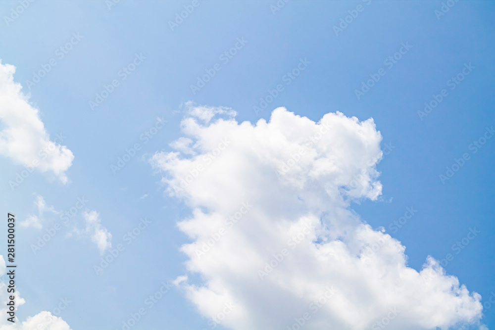 white clouds against the blue sky.