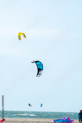 Water sport event, kite surfers race in North Sea near Renesse, Zeeland, Netherlands