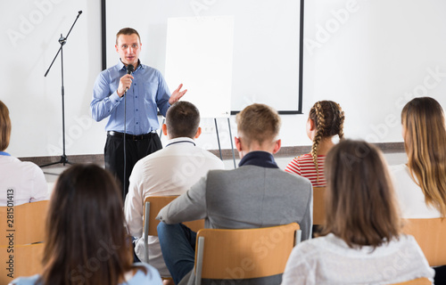 Male coach giving presentation