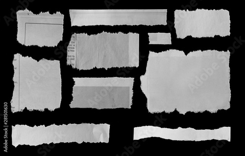 Torn papers on black photo