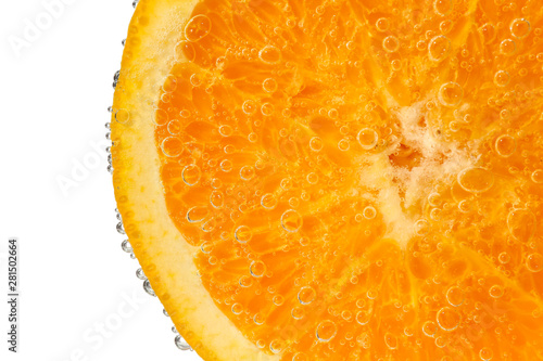 Ripe orange slice in water against white background, closeup