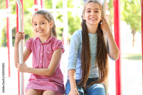 Cute little girls on playgr...