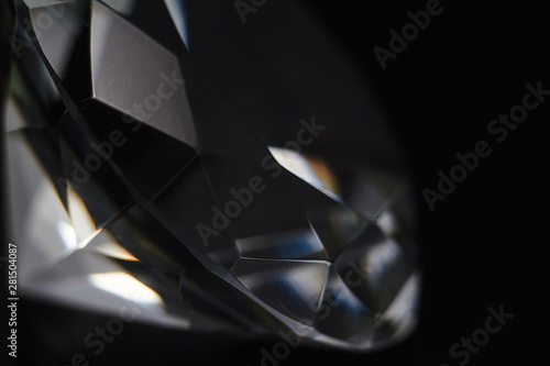 Huge diamond and several chic crystals on a gradient mirror surface, shimmer and sparkle photo