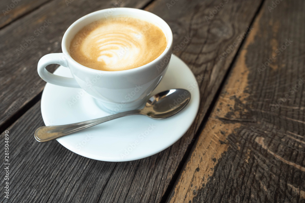 cup of coffee on wooden table