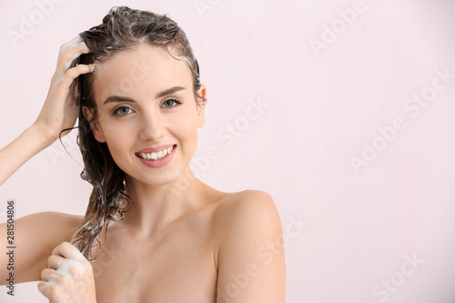 Beautiful young woman washi...