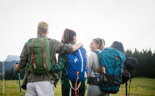 Friends hiking together outdoors exploring the wilderness