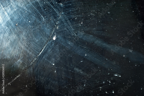 white dust and scratches on a black background. The texture of dirt on the glass.