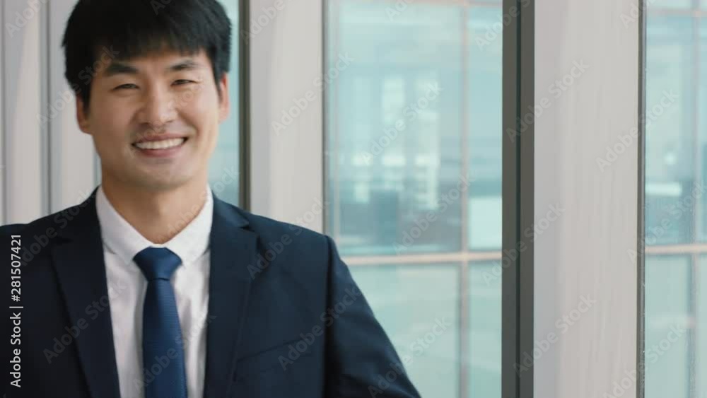 portrait asian businessman smiling confident male executive in office enjoying successful career in corporate leadership company manager at work portrait asian businessman smiling confident male executive in office enjoying successful career in corporate leadership company manager at work