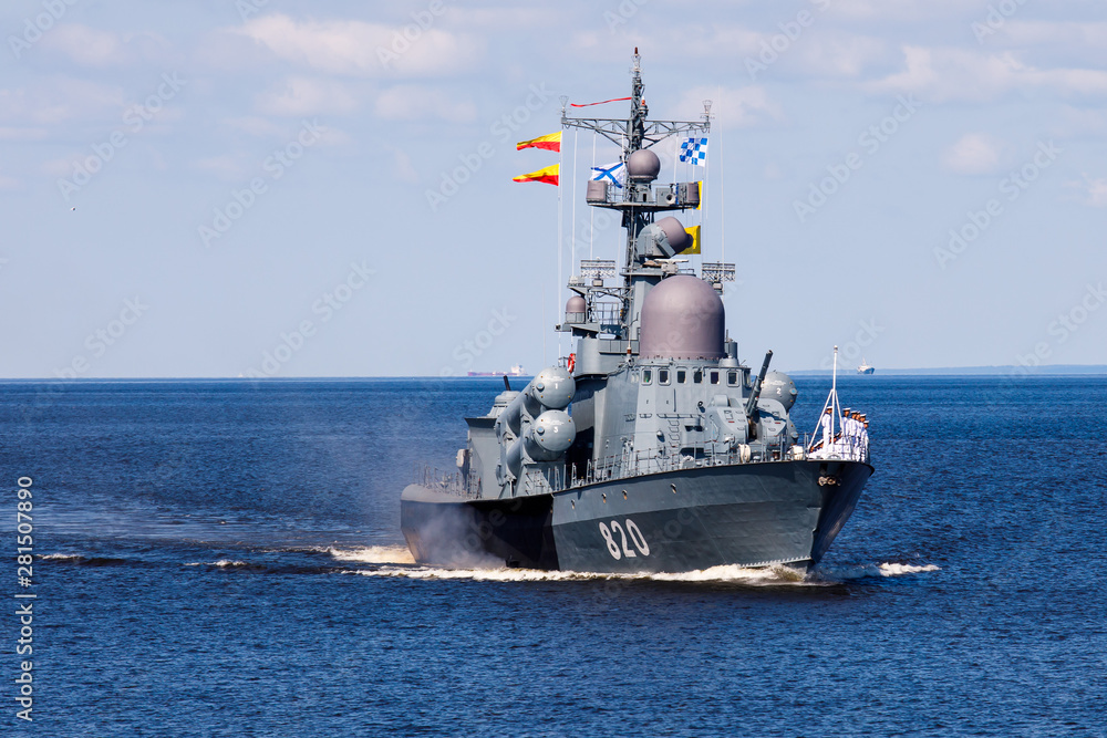 A line ahead of modern russian military naval battleships warships in the row, northern fleet and baltic sea fleet, summer sunny day A line ahead of modern russian military naval battleships warships in the row, northern fleet and baltic sea fleet, summer sunny day