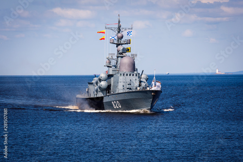 A line ahead of modern russian military naval battleships warships in the row, northern fleet and baltic sea fleet, summer sunny day