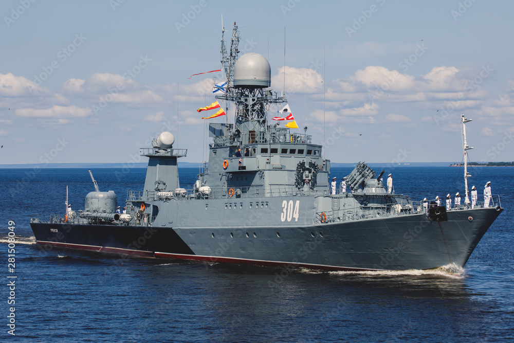 A line ahead of modern russian military naval battleships warships in the row, northern fleet and baltic sea fleet, summer sunny day A line ahead of modern russian military naval battleships warships in the row, northern fleet and baltic sea fleet, summer sunny day