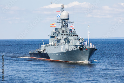 A line ahead of modern russian military naval battleships warships in the row, northern fleet and baltic sea fleet, summer sunny day © tsuguliev