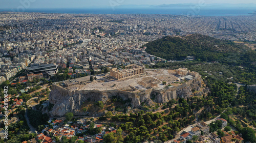 Aerial drone photo of iconic Plaka and Monastiraki districts and iconic Acropolis hill with masterpiece of Western Ancient world the Parthenon, Athens historic centre, Attica, Greece © aerial-drone