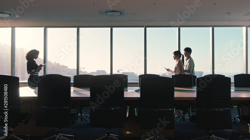 business people shaking hands consultant greeting international clients with handshake planning partnership deal female executive meeting shareholders in corporate office at sunset photo