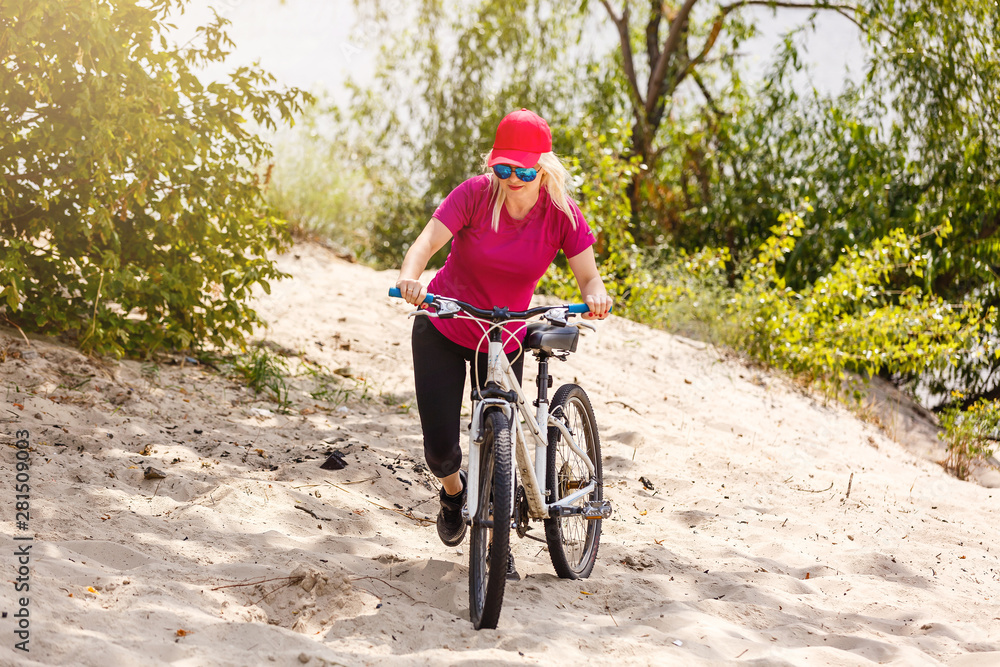 beautiful blonde in a field on a bicycle beautiful blonde in a field on a bicycle