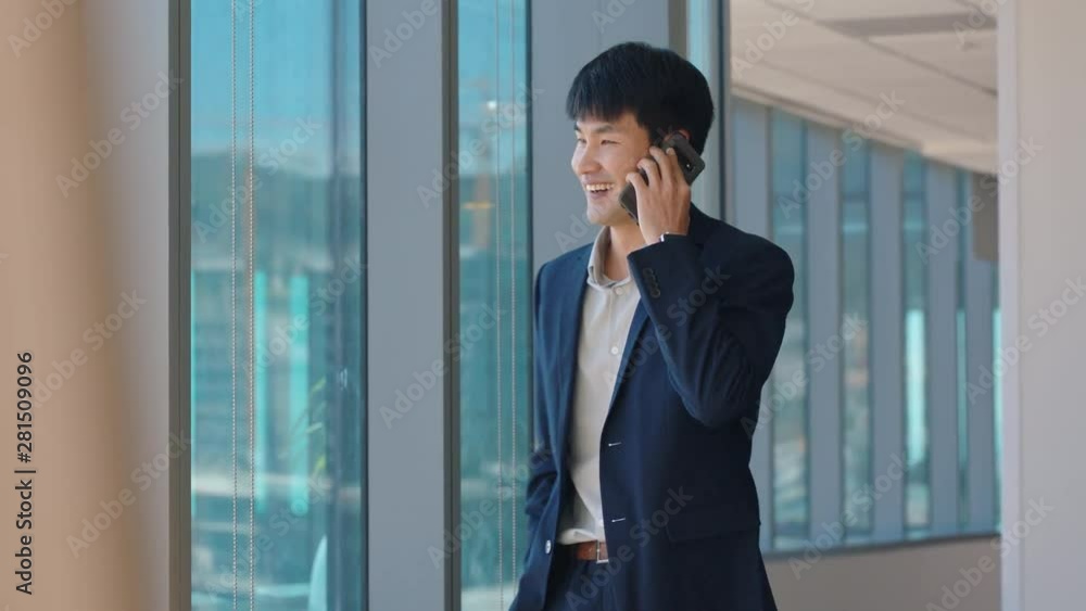 asian businessman using smartphone chatting to client financial advisor negotiating business deal corporate sales executive sharing expert advice having phone call in office looking out window asian businessman using smartphone chatting to client financial advisor negotiating business deal corporate sales executive sharing expert advice having phone call in office looking out window