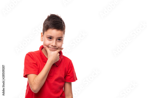 Portrait of a smiling boy  thinking about something pleasant , isolated