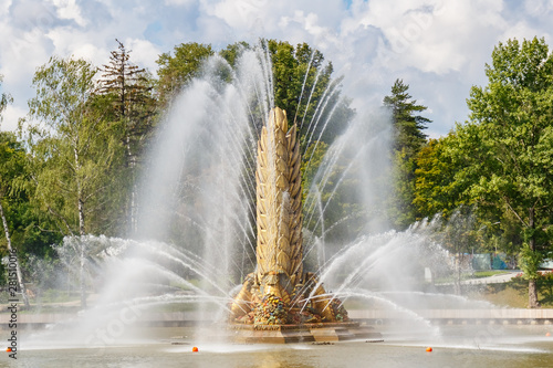 Golden Spike fountain in VDNH park in Moscow closeup at sunny summer day. VDNH park is russian popular touristic landmark